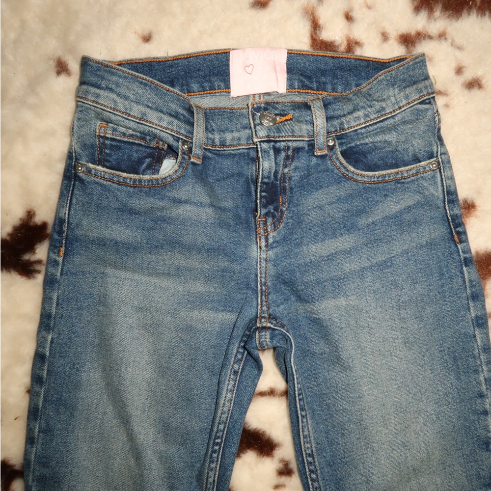 Medium wash blue mid rise Revice Denim bootcut jeans